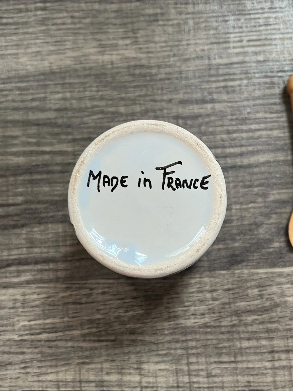 Small homemade French hand painted mustard jar with wooden spoon. Ceramic